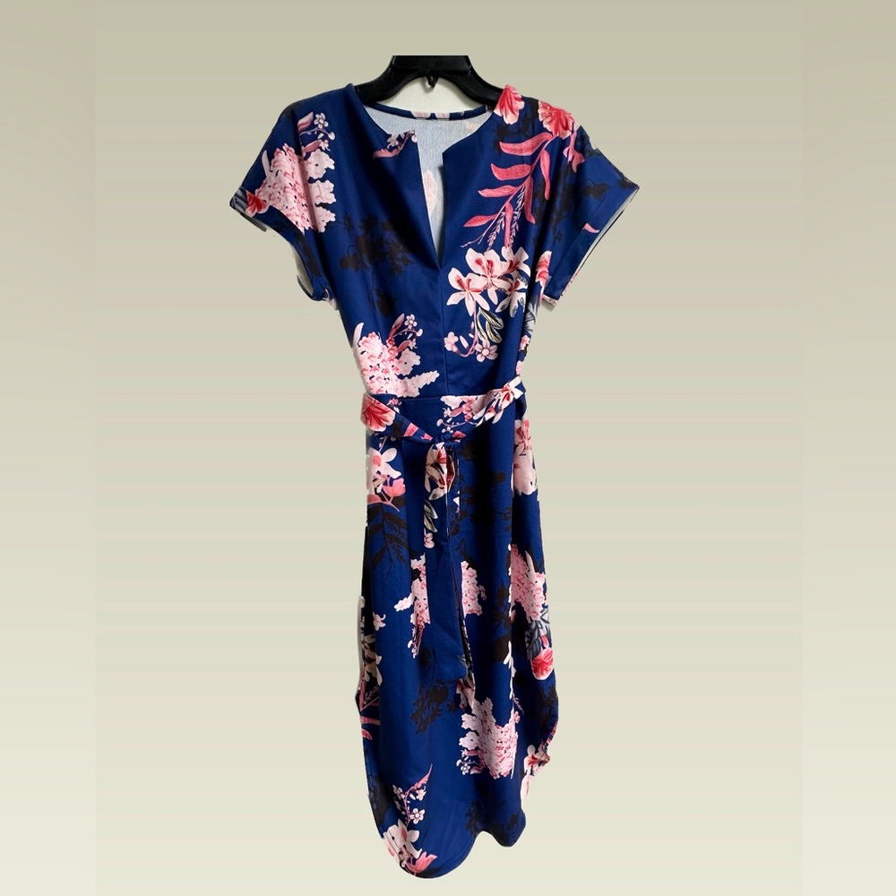Never worn. Floral Dress.  Can wear with belt or straight and flowy.